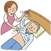 ベッド上の高齢者が更衣介助を受けているイラスト